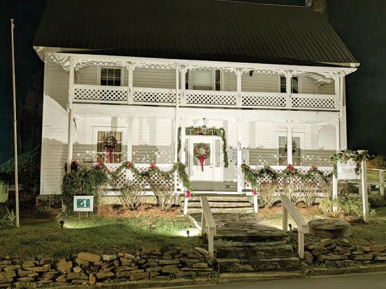 The Tabor House Museum at night, decorated for Christmas. The historic home is at 138 Spring Street in Ellijay. (Gilmer County Historical Society photo)