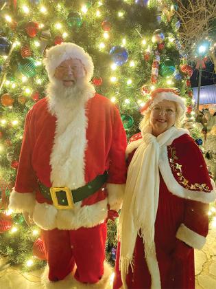Santa and Mrs. Claus pause for a picture after the tree lighting.