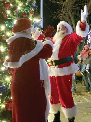 After the crowd shouts the countdown, Santa lights up the Christmas Tree at the Merry Mountain Town Festival Friday night.