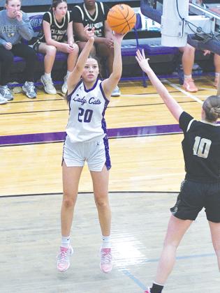 Chelsey Griggs shoots a baseline jump shot versus Calhoun, and she scored 25 points and collected 11 rebounds the following day against Fannin County.
