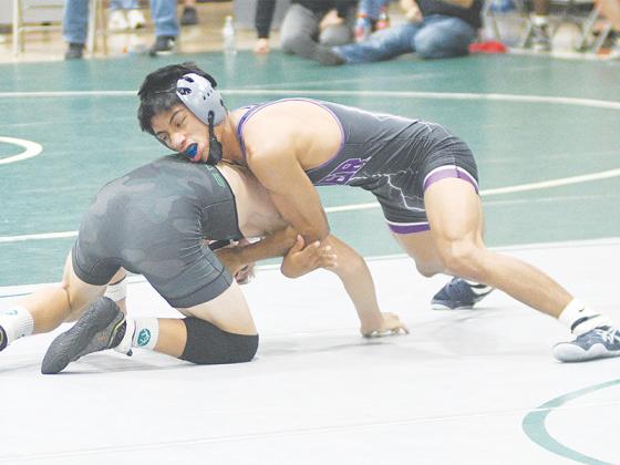 Gilmer’s Eddie Alonzo controls his opponent and helped the Bobcats win 10 straight matches over the Thanksgiving holiday.