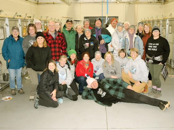 Volunteers at the Gilmer County Animal Shelter prepare to give the shelter’s dogs a delicious Thanksgiving feast.