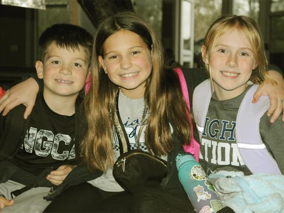 North Georgia Christian Academy students have fun together while waiting for their parents to pick them up. Shown from left are Brady Pugh, Elizabeth Pugh and Lakota Rezmer.