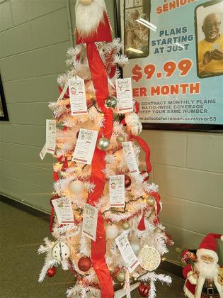 Emily Beck’s Giving Tree is decorated with family requests for presents and needs. 