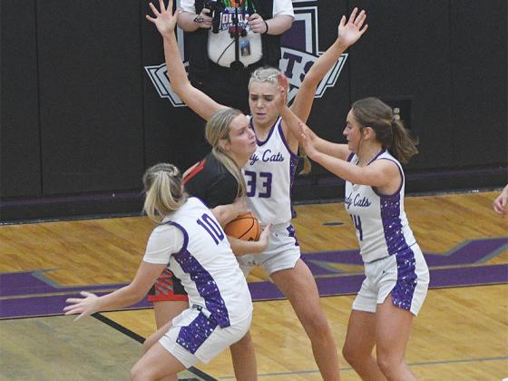 The Lady Cats’ defensive play has been a hallmark of the team this season as displayed by Mak Taylor (10), Jace Sanderson (33) and Bree Burnette (14) at the Piedmont Holiday Classic.