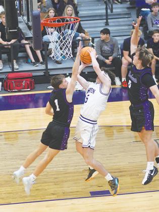 Bobcat seniors Alex Miltiades (1) and Keegen Bryant (0) defend on a fast break. Bryant was named to the all-tournament team for his performance over a three-game span at North Forsyth.