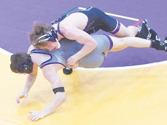 Bobcat Braelyn Nelson scores a takedown versus his Union County opponent last Wednesday. He went on to secure a pin for his 100th career win as a GHS wrestler.