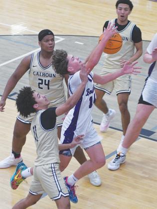 Gilmer’s Noah Rice is fouled in transition in the Bobcats’ game last Friday versus Calhoun.