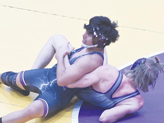Gilmer High School junior Adolfo Bautista works on scoring near-fall points and has helped the Bobcats achieve a 19-1 dual record this season.