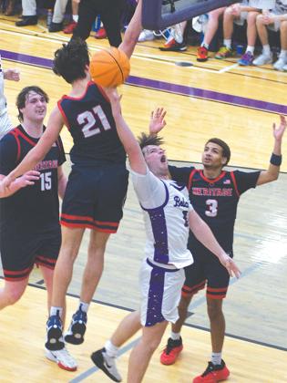 Bobcat Keegen Bryant dices through the lane for a reverse layup and two points against Heritage.