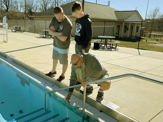 Participants in the Freeze for the Team fundraiser test the water before taking a polar plunge. You’ve got to be tough to swim in Gilmer’s winter weather. Shown from left are Scott Smith, Reece Smith and Alton Guidry.