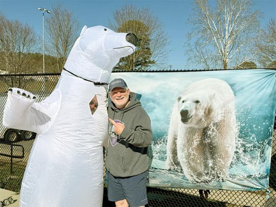 Keith Kucera, left, dressed as a polar bear beside Robert Ferguson, right, at the Freeze with the Team fundraiser. Sometimes it can be helpful to have a polar bear around.