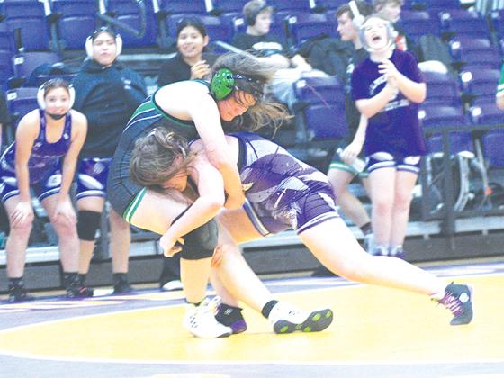 Gilmer’s Lucy Ann McArthur takes her opponent down and placed third at last Saturday’s Gilmer Bobcat Bash.