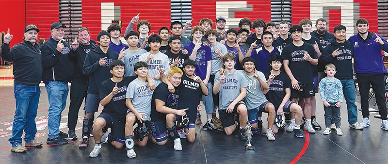 Above are Gilmer’s wrestlers and coaches last Saturday following the Bobcats’ Region 7-3A duals championship. It was their second in a row and 13th over the past 14 seasons. (Contributed photo)