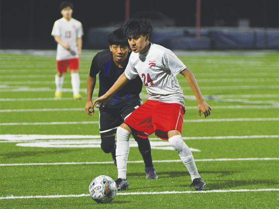 Senior Brayner Ortiz (left) gets in defensive position and scored four goals last week for Gilmer.