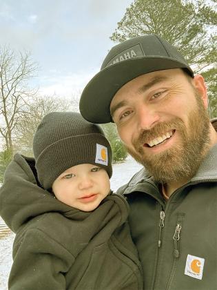 Tate Davis, right, and his father Austin Davis, left, enjoy a snowfall in Gilmer County. (Photos submitted by Austin Davis)
