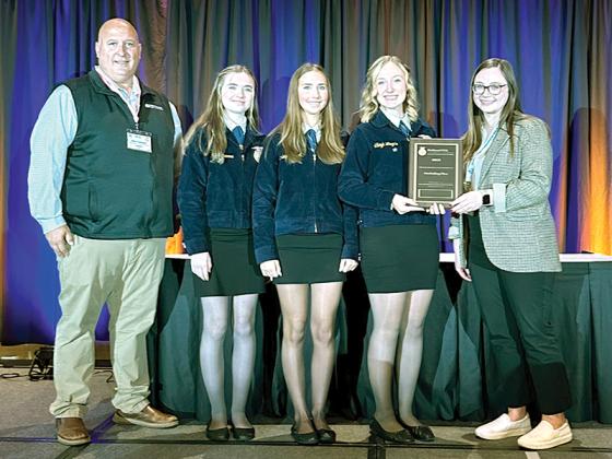 Gilmer County’s National FFA Marketing Plan Career Development Event students learned they are ranked among the top eight in the nation as they receive Gold Emblem honors. Shown from left are NAU County Insurance Company Lead Marketing Specialist Nick Oswald, Carly Whittemore, Carleigh Bedwell, and Adleigh Wingate and Government Affairs and Bunge Senior Government Affairs Analyst Madison Bader.