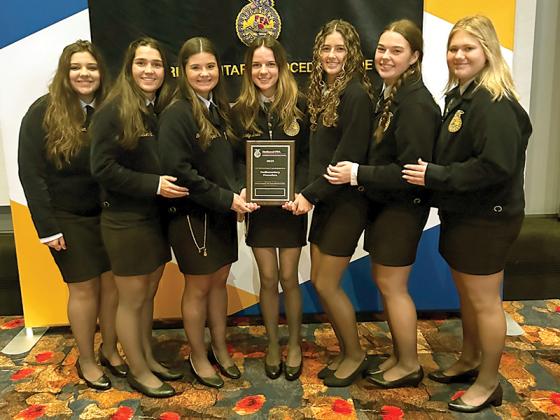 Gilmer FFA students won Silver Emblem Award sat the National FFA Convention for Parliamentary Procedure. Shown from left are Emma Kate Bramlett, Madison Hall, Gracie Gaitanoglou, Madelyn Davis, Sadie Johnson, Ava Smith and Chloe Prosser. with their Silver Emblem Award at the National FFA Convention.
