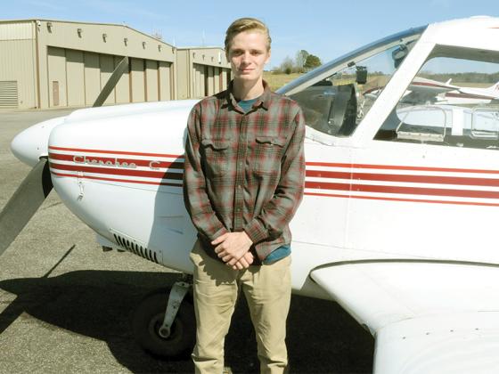 Evan Snyder stands next to his plane a day after misunderstanding a presidential restricted air space warning.