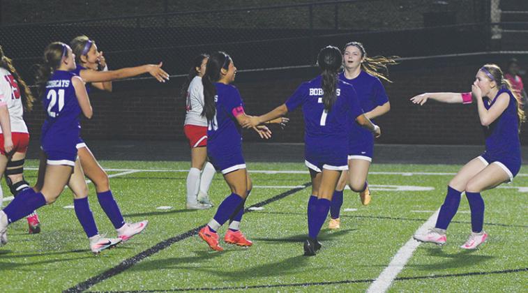 From left, Gilmer’s Jessie Wheeler, Jazmin Landeverde, Selina Tercero, Salma Gonzalez, Brenlee Daniel and Joei Marshall celebrate a Lady Cat goal in the second half last Thursday.