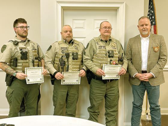Gilmer County Deputy Dustin Cooper, Cpl. Rodney Sawyer and Sgt. Tommy Humphries were awarded Medal of Merits by Gilmer County Sheriff Stacy Nicholson for actions they took to save the life of an individual.