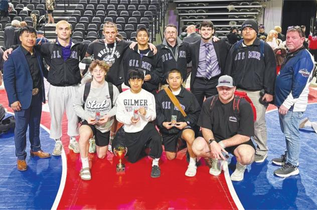 Along with Gilmer High School Lady Cat Abelinda Tercero (below) are Bobcat state qualifiers, placers and coaches from last week’s traditional wrestling tournament.