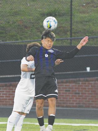 Bobcat Ronald Cuz heads the ball for Gilmer in their region match versus Calhoun last Friday.