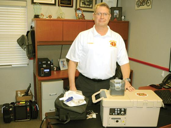 Gilmer Fire and Rescue Chief Paul Beamon displays his department’s new blood transfusion kit. This technology will save lives.