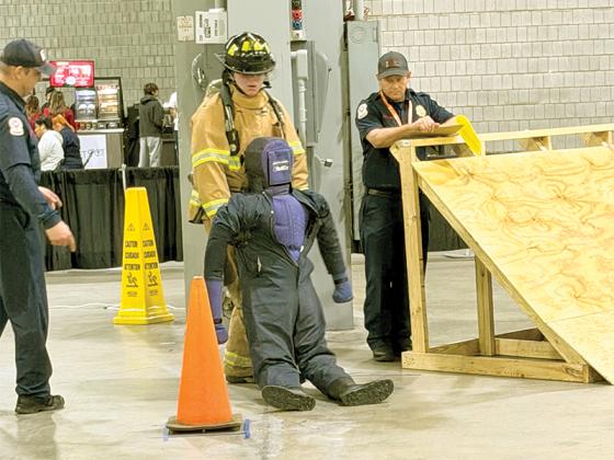 Gilmer student Clifford DeFoor drags a dummy at the SkillsUSA firefighting competition. (Contributed photos)