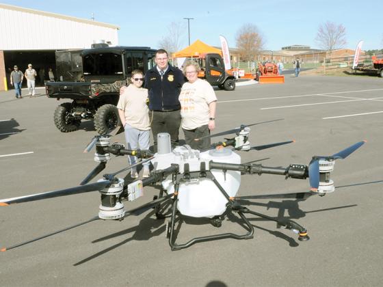 An FFA family looks at a new crop duster drone at the Georgia Ag Expo Saturday, March 14. Shown from left are Luke Oliver, John Oliver and Melissa Oliver.