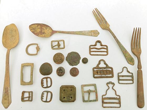 In his many adventures as a treasure hunter, Joseph Hunter has found artifacts including these spoons, forks and belt buckles.