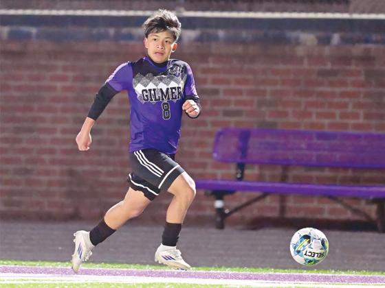 Gilmer sophomore Ronald Cuz dribbles downfield and scored four goals last week to set a new program standard.