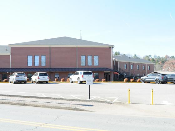 The newly fenced-off parking lot of First Baptist Church of Ellijay provides parking space for visitors to downtown.