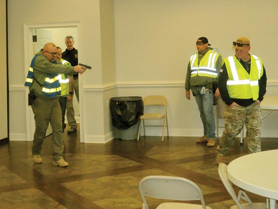 Emergency service workers carry a “victim” to safety during an active shooter drill Thursday, March 26.
