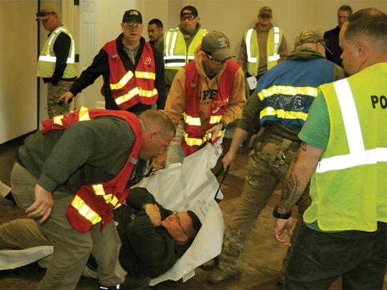 Ellijay Police Department Assistant Chief Ray Grace clears a room during an active shooter drill Thursday, March 26.