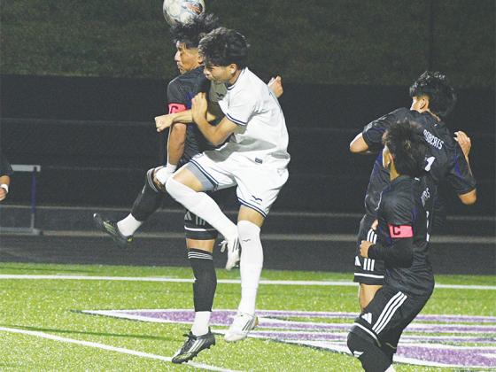 Bobcat Keby Puac heads a ball away to clear a corner kick versus Southeast Whitfield  last Tuesday.