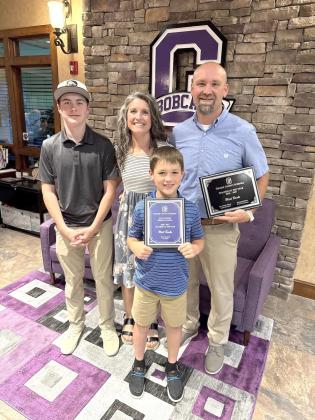 Matt Banks’s family celebrate after he received the Teacher of the Year Award. Shown from left are Gunner Banks, Lindsay Banks, Grey Banks and Matt Banks.