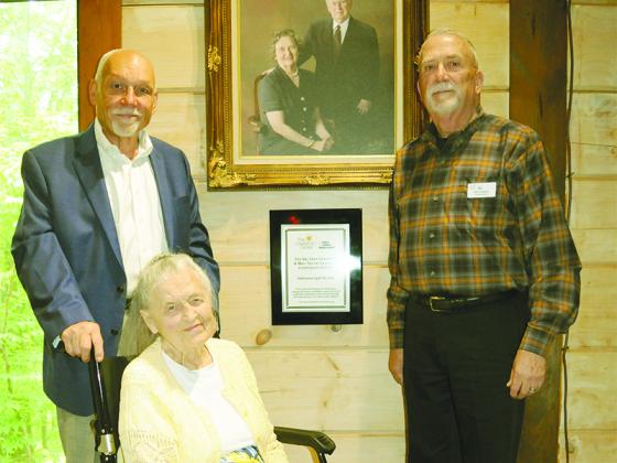 The Craddock family and the Craddock Center director celebrate the center’s 25th anniversary. Shown from left are John Craddock, Nettie Craddock and Director Krik Cameron.