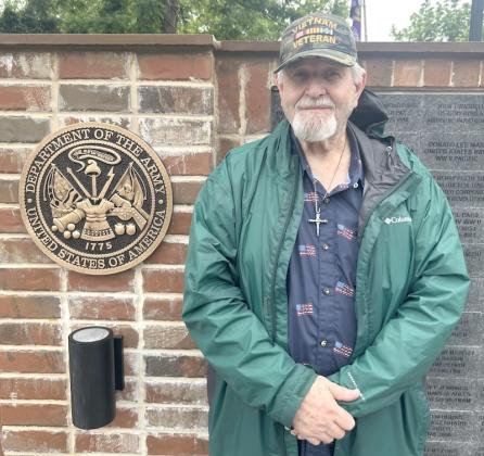 Vietnam veteran and Army Specialist John Jarrard commemorates Memorial Day at the Gilmer Veterans Memorial Wall Monday, May 25.