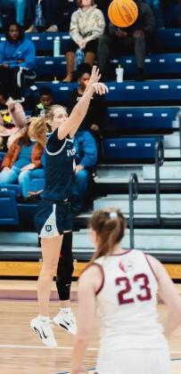 Elly Callihan shoots a three-pointer for Berry College. She graduated as the program's career rebounding leader, surpassed 1,000 points and earned a pair of second-team all-conference selections.