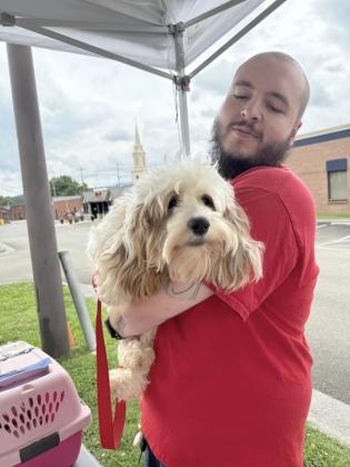 Friends of Gilmer Animal Shelter Veterinary Assistant Malachi Balance prepares to discharge a freshly-fixed dog.
