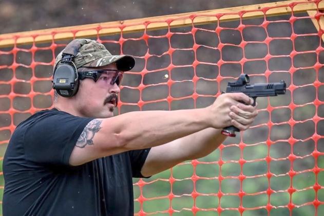 Gilmer County Sheriff's Office Deputy Sheriff Jake Knight fires his pistol during a stage of shooting at the June 2026 Georgia Police and Fire Games. Below, Knight focuses on a target during a stage of shooting at the games.