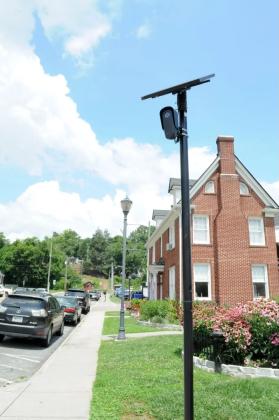 A Flock camera owned by the Ellijay Police Department watches downtown Elljay.