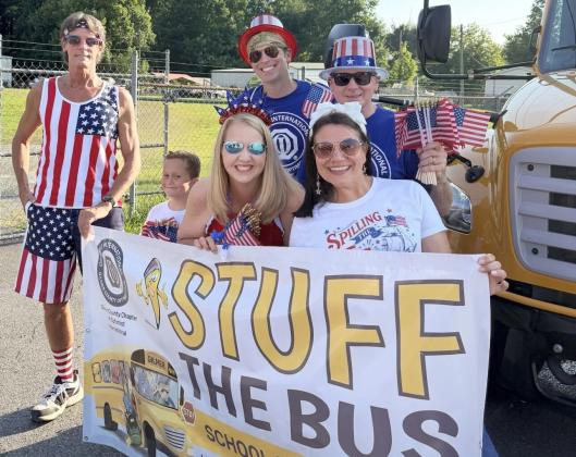 Optimist Club volunteers for Stuff the Bus get ready for the fundraiser. Shown from left are, front row, Caius Slavenas, Rebecca Harrell and Carolyn Slavenas; and, back row, Mark Congdon, Chad Hoge and Kevin Moody.