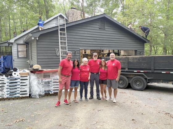 Phoenix Roofing Systems crews get to work on providing a veteran family a new roof. Shown from left are Phoenix Roofing Systems Managing Partner Albert Zavala, Maria Zavala, Sue Wheeler, Ron Wheeler, Sandra Cox and Zack Cox.