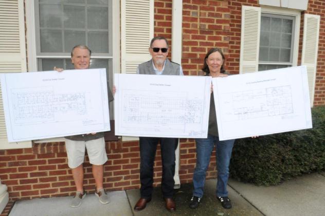 Gilmer County Animal Shelter (GCAS) leaders display the plans for the new shelter. Shown from left are GCAS Advisory Committee member Ed Bruce, GCAS Advisory Committee member Rick Gutknecht and GCAS Kelly Pickering.