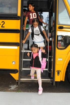 Ellijay Elementary School students get off the bus for their first day of school on Monday, Aug. 3.