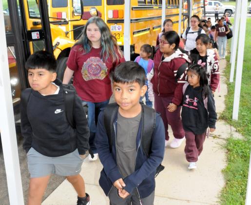 Students walk into Ellijay Elementary School for the first day of school on Monday, Aug. 3.