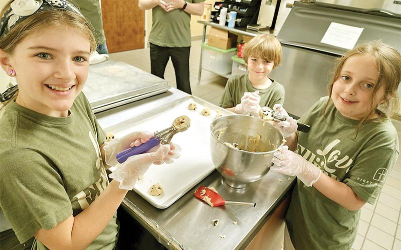 Kids from First Baptist Church of Ellijay make cookies and thank you cards for Gilmer first responders. Shown from left are Addy Hayes, Luke Hayes and Chandler Garrett.