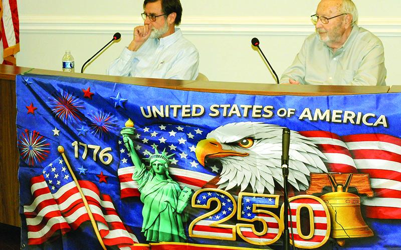 Doug Rink, left, and Chairman Charlie Paris, right, debate each other in their primary race for Board of County Commissioners Chairman.